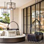 Black Ring Round Metal With Black Seating On The Terrace, White Round Sofa, Glass Covered Chandelier