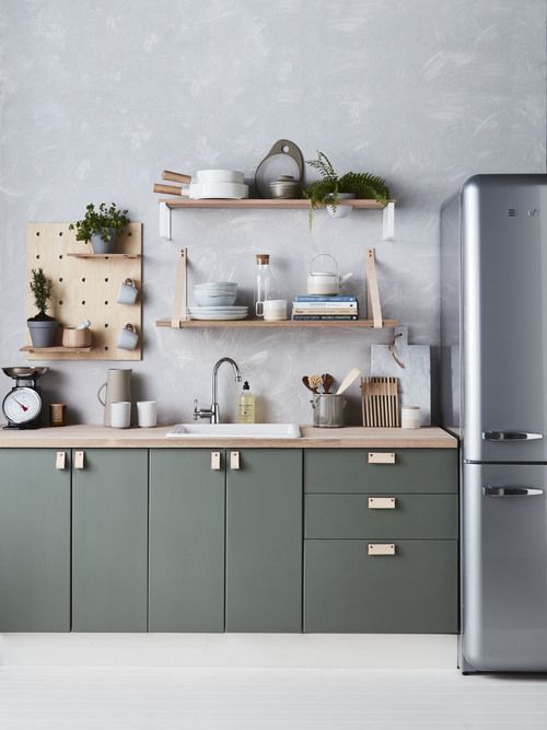 kitchen, white floor, deep green bottom cabinet, grey wall, silver fridge