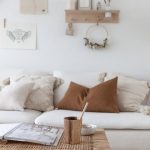 Living Room, White Sofa, White Wall, White Floor, Wooden Rattan Coffee Table, Floating Shelves,