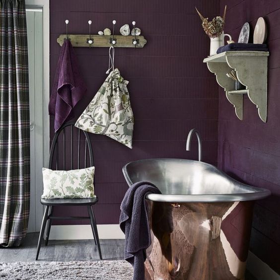 bathroom, purple wall plank, silver tub, floating shelves, wooden floor, rug