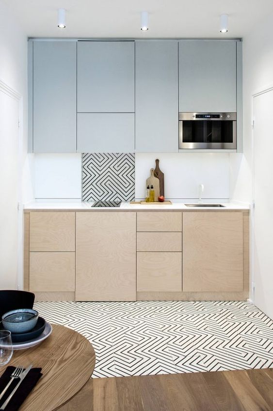 kitchen, wooden floor, white patterned floor, white wall, wooden cabinet, white backsplash, grey upper cabinet