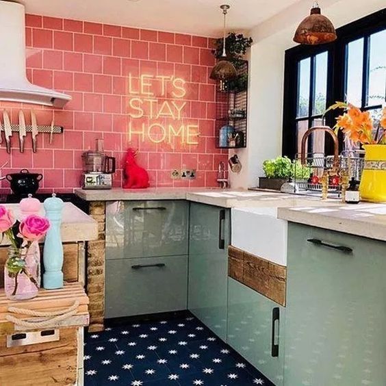 vintage kitchen, mint green counter, white top, pink wall tiles, navy patterned floor tiles, white wall