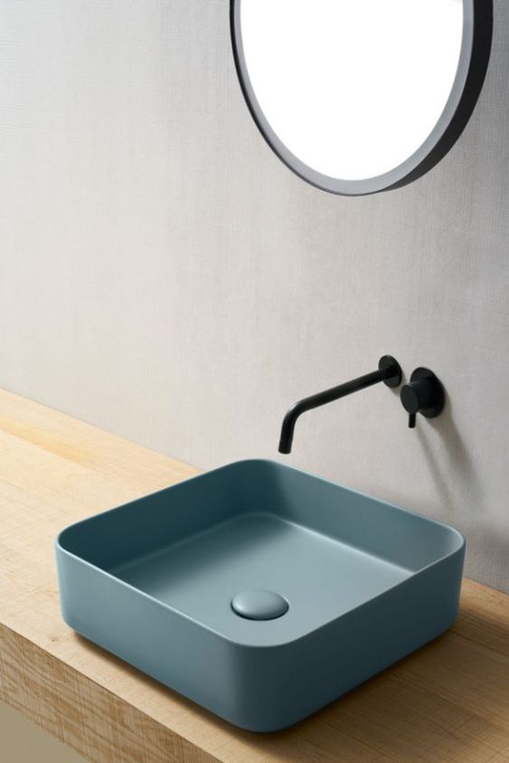 blue square sink, wooden floating vanity, round mirror, black faucet