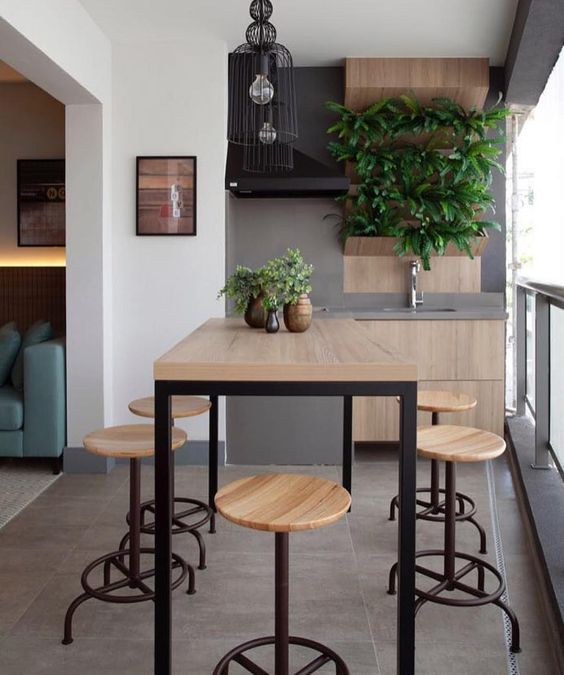 patio, grey floor, white wall, grey accent wall, floating wooden cabinet, wooden table, wooden stools