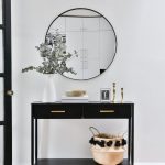 Hallway, White Wall, Black Console Table With Drawers, Round Mirror, White Vase