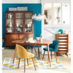 Dining Room, White Wall, Blue Wall, Wooden Riangle Table, Blue Velvet Chairs, Yellow Velvet Chair, Glass Pendant, Blue Yellows Rug