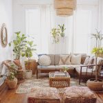 Living Room, Wooden Floor, Brown Patterned Rug, Brown Floor Pillows, Wooden Sofa, White Cushion, Rattan Chairs, Rattan Plant Pot, Rattan Pendant, White Curtain