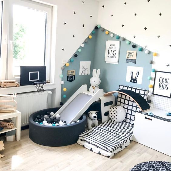 baby room, wooden floor, white wall, blue wall, white cushion, black round box, slide